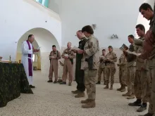 Mass for U.S. military personnel at a forward operating base in Kandahar, Afghanistan, Dec. 23, 2001.