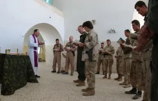 Mass for U.S. military personnel at a forward operating base in Kandahar, Afghanistan, Dec. 23, 2001. U.S. Navy photo by chief photographer's mate Johnny Bivera (Public Domain).