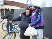 A Caritas-Spes worker brings aid to people near Kyiv, Ukraine.