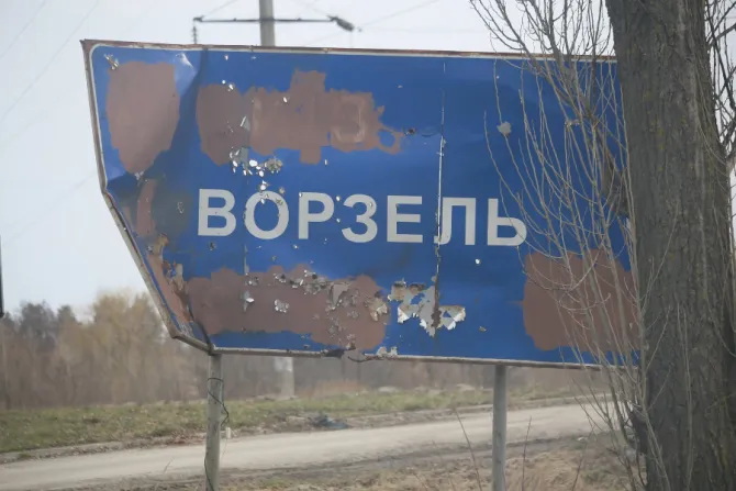 A damaged sign at the entrance to Vorzel, a village near the Ukrainian capital Kyiv.