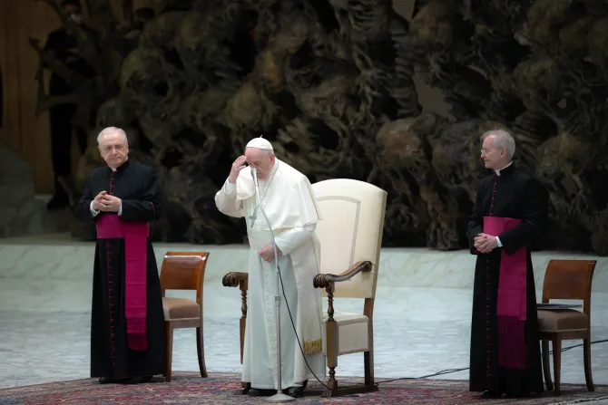 Pope Francis prays at his General Audience in the Vatican's Paul VI Hall, Feb. 2, 2022.