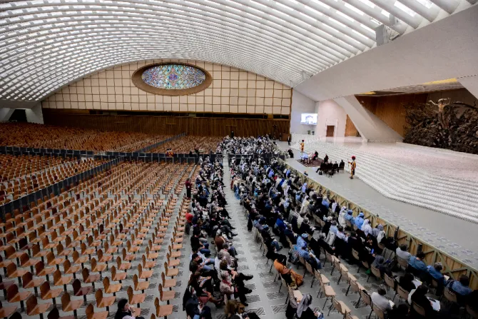 Pope Francis enters the Vatican’s Paul VI Hall in a wheelchair on May 5, 2022