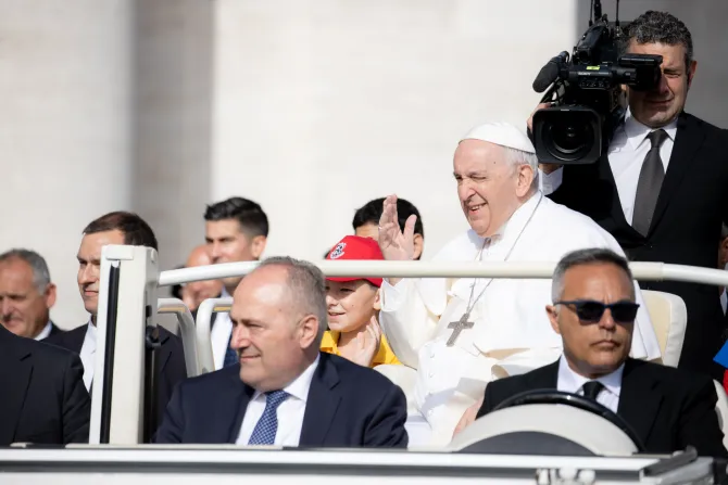 Pope Francis shares a popemobile ride with Ukrainian children before the general audience on June 22, 2022