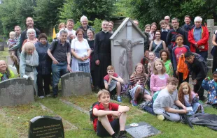 Pilgrims gather around Chesterton’s grave at Beaconsfield during July 25, 2020 pilgrimage Photo courtesy of Catholic GKC Society