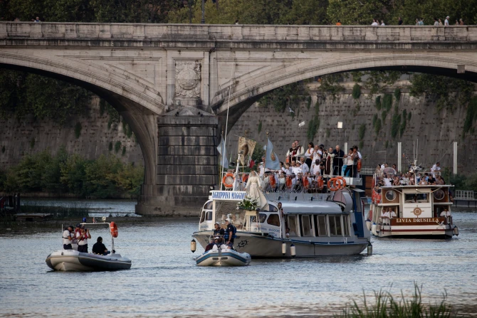 A floating procession of Our Lady of Mount Carmel on a boat in Rome’s Tiber River on July 24, 2022.