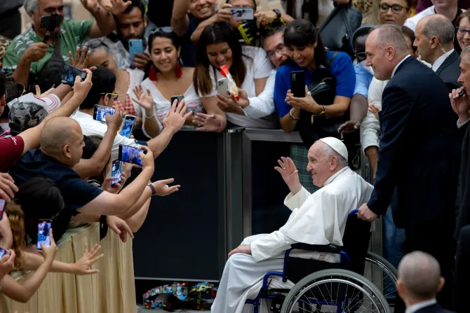 Pope Francis greeted the crowd in a wheelchair at the end of his general audience on Aug. 3, 2022.