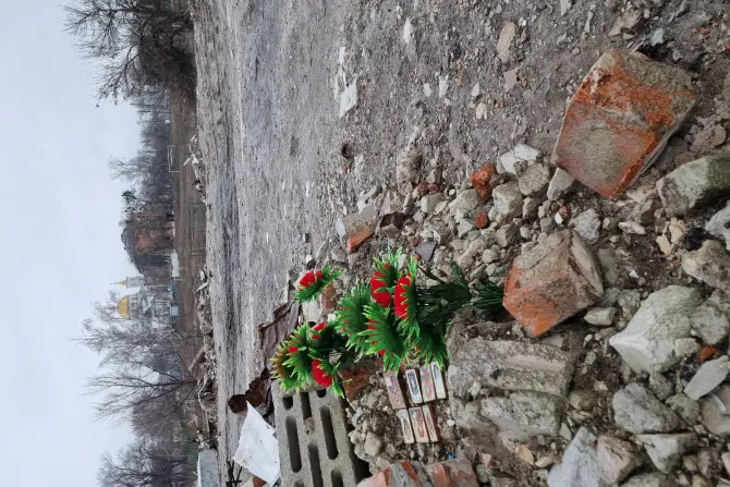 Flowers and icons placed among the ruins in Izium, Ukraine
