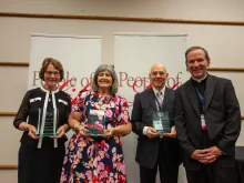 The U.S. Conference of Catholic Bishops on July 17, 2023, honored three champions of the pro-life cause at its People of Life awards during the annual Diocesan Pro-Life Leadership Conference in Toledo, Ohio. Pictured left to right are award recipients Margaret Hartshorn and Aurora Tinajero; Keith Moseley, husband of Kathryn Moseley, who passed away in June and received the award posthumously; and Bishop Michael Burbidge, chairman of the USCCB Committee on Pro-Life Activities.