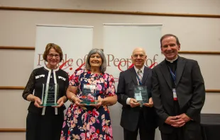 The U.S. Conference of Catholic Bishops on July 17, 2023, honored three champions of the pro-life cause at its People of Life awards during the annual Diocesan Pro-Life Leadership Conference in Toledo, Ohio. Pictured left to right are award recipients Margaret Hartshorn and Aurora Tinajero; Keith Moseley, husband of Kathryn Moseley, who passed away in June and received the award posthumously; and Bishop Michael Burbidge, chairman of the USCCB Committee on Pro-Life Activities. Credit: Photo courtesy of USCCB