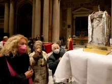 The faithful venerate a relic of Blessed Rosario Livatino at the Church of San Salvatore in Lauro, Italy, Jan. 20, 2023.