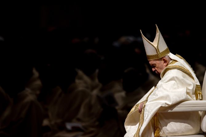 Pope Francis prays during the Easter Vigil Mass in St. Peter's Basilica on April 8, 2023.