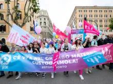 Members of an Italian pro-life and pro-family organization marched in the "Demonstration for Life" May 20, 2023, with a banner saying "There's life in the mother's womb. Let's care for it. #stopabortion"