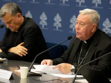 Cardinal Jean-Claude Hollerich (right), relator general of Synod on Synodality, speaks to the media on June 20, 2023, at the temporary headquarters of the Holy See Press Office in Vatican City. Beside him is Cardinal Mario Grech, the secretary general for the Synod of Bishops.