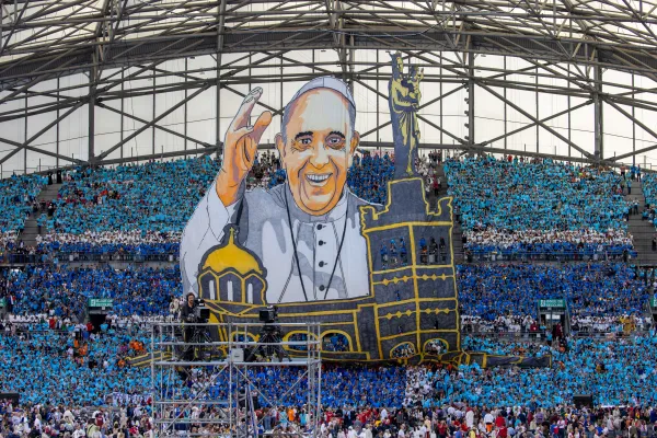 A banner of Pope Francis with the Basilica of Notre Dame de la Garde, or the Basilica of Our Lady of the Guard, is displayed at Vélodrome Stadium in Marseille, France, on Sept. 23, 2023. Pope Francis celebrated Mass at the stadium on the final day of his Sept. 22-23, 2023, visit to the port city. Daniel Ibanez/CNA