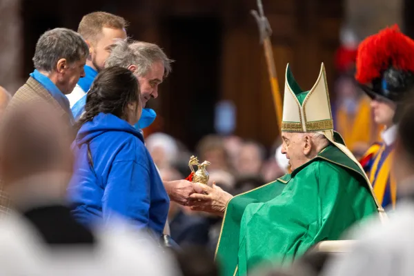 Pope Francis receives the offertory gifts during a Mass in St. Peter's Basilica to mark the Church's seventh World Day of the Poor on Nov. 19, 2023. Among those who brought the gifts to Pope Francis were two people with blindness. Credit: Daniel Ibanez/CNA.