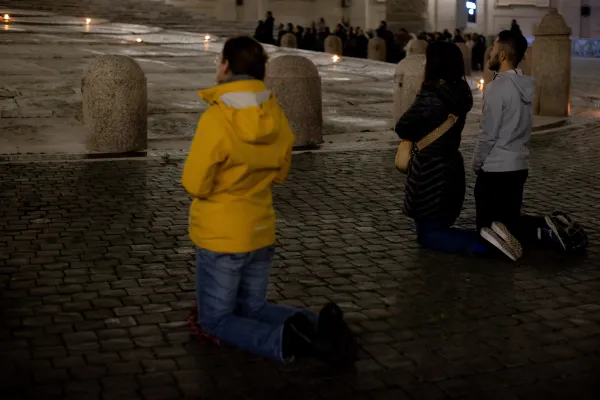 Adorers kneel in front of the Eucharist in St. Peter's Square March 14, 2023. Daniel Ibanez/CNA