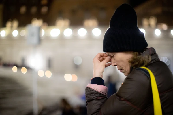 A woman prays in front of the Eucharist during a holy hour in St. Peter's Square March 14, 2023. Daniel Ibanez/CNA