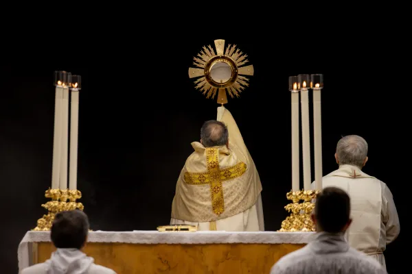 Cardinal Mauro Gambetti lifts the Eucharist during benediction at the end of adoration March 14, 2023. Daniel Ibanez/CNA