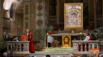 Catholics gather in Rome’s Basilica of St. Bartholomew on Tiber Island on Holy Tuesday, March 26, 2024, for a prayer vigil honoring Christians who have been killed for their faith in recent years.