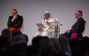 Pope Francis speaks at the 50th annual Social Week of Catholics in Trieste, Italy, on the morning of July 7, 2024. At his arrival in the northern Italian city, he was greeted by Archbishop Luigi Renna, president of the organizing committee (right), and Cardinal Matteo Maria Zuppi, president of the Italian bishops' conference (left). Credit: Daniel Ibanez/CNA