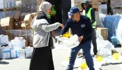 Catholic Relief Services workers help to distribute humanitarian aid materials to Gazan civilians in March 2024.