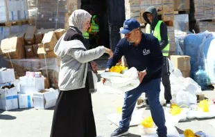 Catholic Relief Services workers help to distribute humanitarian aid materials to Gazan civilians in March 2024. Credit: Photo courtesy of Catholic Relief Services