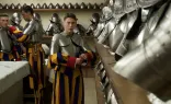 Swiss Guard cadets prepare their armor in the guards' barracks at the Vatican on April 30, 2024.