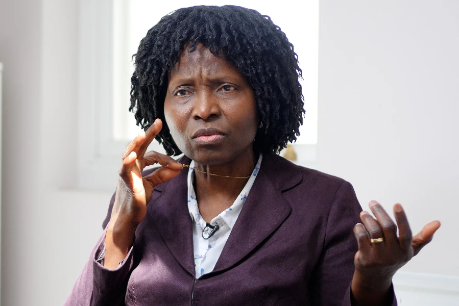 Nurse Mary Onuoha holds the cross on her necklace.?w=200&h=150