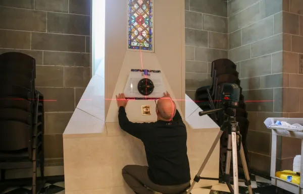 Keith Calleja began installation of relics on Jan. 8, 2024, starting with the relic of St. Philip. Credit: Photo courtesy of Detroit Catholic