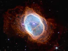 NASA’s Webb captures a dying star’s Final ‘Performance’ in fine detail: A planetary nebula, shaped like an irregular oval, with lacy, reddish orange plumes of gas and dust.