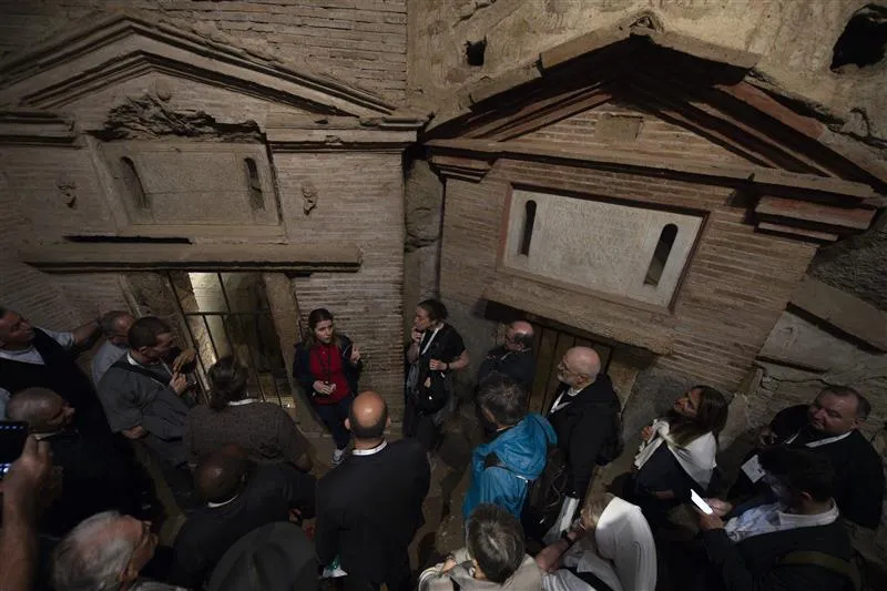 An archaeological guide provided historical information and answered questions during a visit to the catacombs by delegates of the Synod on Synodality. Early Christians gathered within the catacombs for funeral rites and to honor the martyrs. Rome, Italy. Oct. 12, 2023.?w=200&h=150