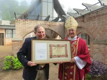Bishop Steven Raica of Birmingham, Alabama, presented EWTN's vice president of theology, Colin Donovan, with the Pontifical International Marian Academy's Letter of Appointment and Diploma during a Mass on Aug. 9, 2023.