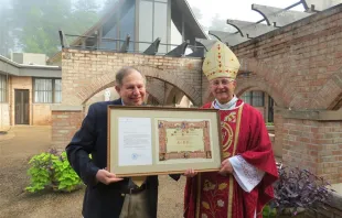 Bishop Steven Raica of Birmingham, Alabama, presented EWTN's vice president of theology, Colin Donovan, with the Pontifical International Marian Academy's Letter of Appointment and Diploma during a Mass on Aug. 9, 2023. EWTN