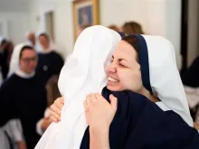 Two religious sisters in Sisters of Life embrace.