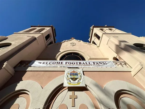 A sign that says “Welcome football fans!” hangs on St. Mary’s Basilica in Phoenix during Super Bowl week. The Diocese of Phoenix is offering the sacraments and free sacramentals — as well as information on Sunday Mass times and locations — to pedestrians in the city on the days leading up to the NFL Super Bowl, which is Sunday, Feb. 12, 2023, in Glendale, Arizona. Credit: Diocese of Phoenix