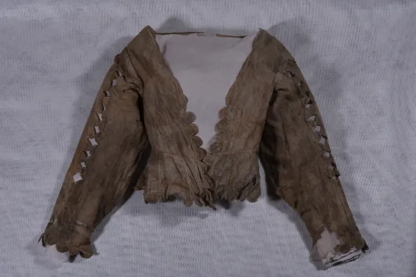 A linen jacket used to wrap bones identified as those of Welsh Catholic martyrs Philip Evans and John Lloyd. / Stonyhurst College.