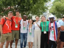 James Nyumah, 23, from Liberia, (pictured third from left) hangs out with new friends from Australia while attending a "Rise Up" session at World Youth Day 2023 in Lisbon, Portugal, on Aug. 2, 2023.