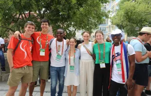 James Nyumah, 23, from Liberia, (pictured third from left) hangs out with new friends from Australia while attending a "Rise Up" session at World Youth Day 2023 in Lisbon, Portugal, on Aug. 2, 2023. Hannah Brockhaus/CNA