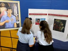 School children read about the life of Blessed Carlo Acutis at the celebration of his new shrine at St. Dominic Parish in Brick, New Jersey. Oct, 1, 2023.