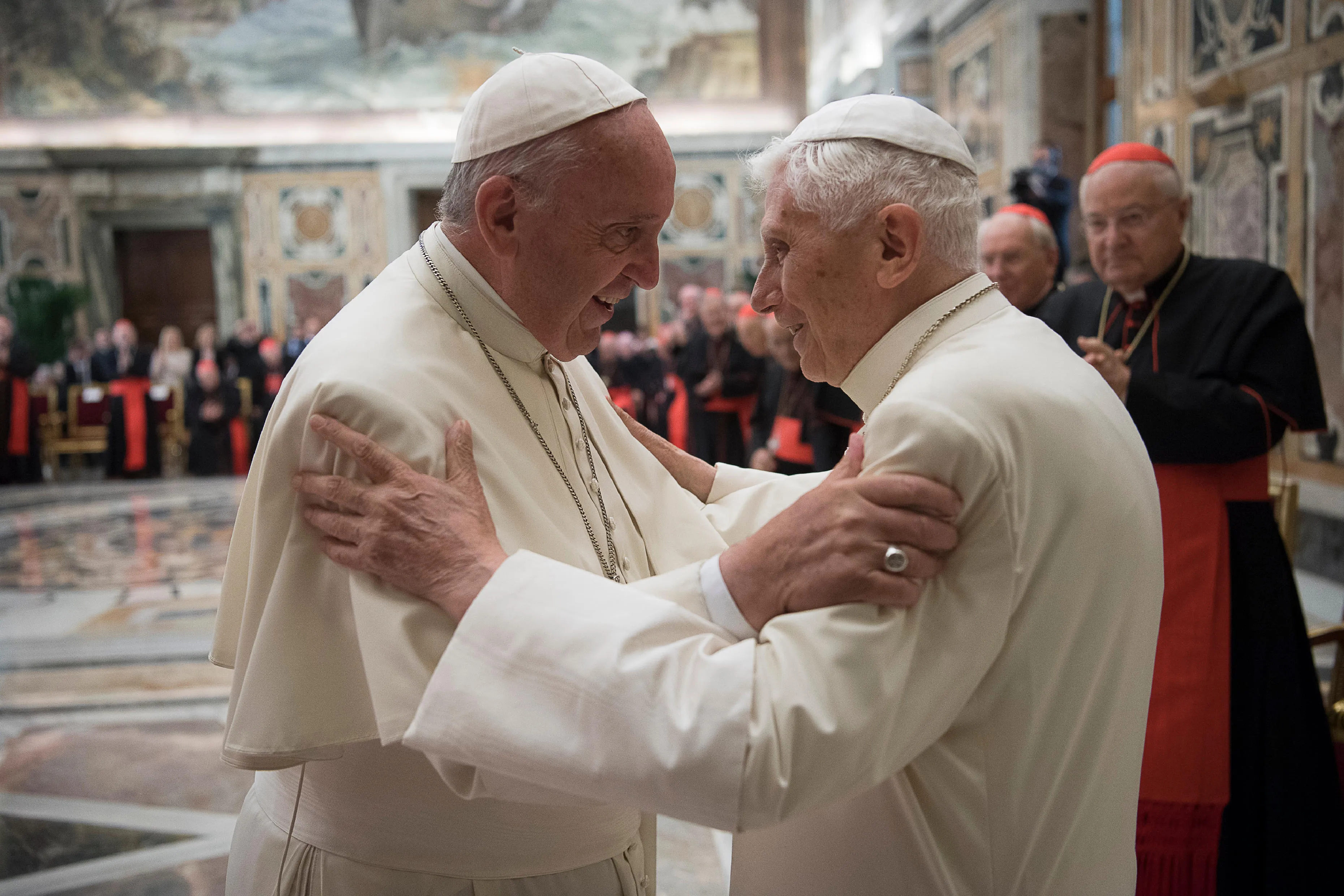 Pope Francis and Pope Emeritus Benedict XVI greet each other at the 65th priestly ordination of Pope Emeritus XVI at the Clementine Hall.?w=200&h=150