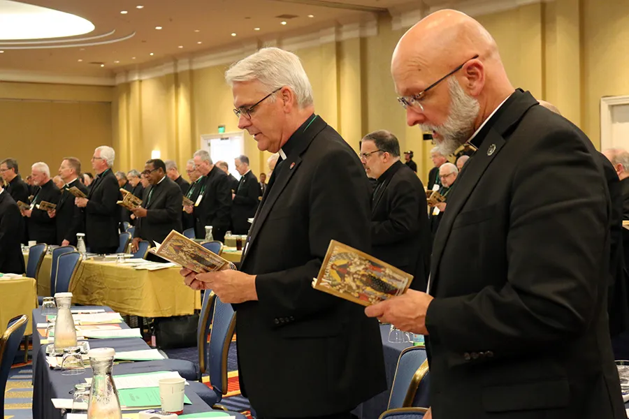Archbishop Paul Coakley of Oklahoma City (Left) and Bishop James Wall of Gallup (Right) pray before the afternoon session of the 2019 USCCB General Assembly, June 12, 2019.?w=200&h=150