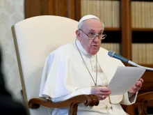 Pope Francis delivers a general audience address in the library of the Apostolic Palace.