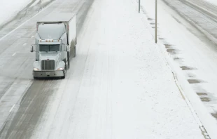 A truck drives south on I-75 in Allen, Texas, U.S., on Wednesday, Feb. 17, 2021. Cooper Neill/Bloomberg via Getty Images.
