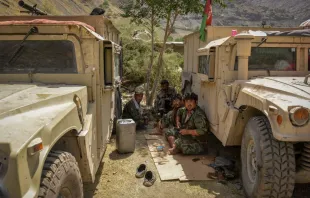 Afghan armed men supporting the Afghan security forces against the Taliban pictured while sitting near their humvee vehicles at Parakh area in Bazarak, Panjshir province, Aug. 19, 2021. Ahmad Sahel Arman/AFP via Getty Images.