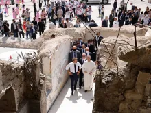 French President Emmanuel Macron tours Our Lady of the Hour Church in Mosul, Iraq, Aug. 29, 2021.
