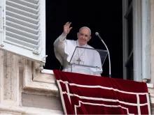 Pope Francis waves from the window of the Apostolic Palace on Feb. 7, 2021.