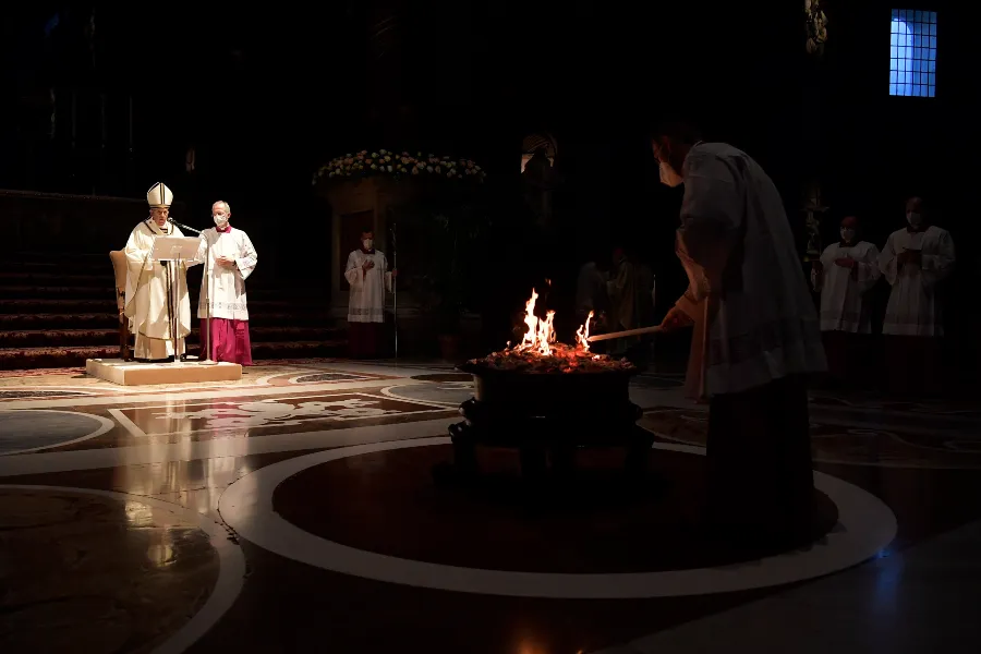 Pope Francis prays before the Easter fire in St. Peter's Basilica on April 3, 2021.?w=200&h=150