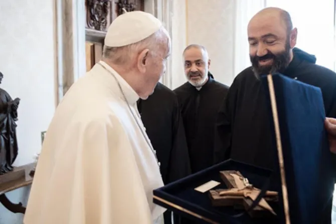Fr. Pierre Najm presents Pope Francis with a crucifix made from rubble left by the Beirut port explosion