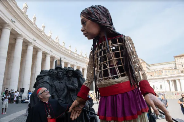 Cardinal Michael Czerny with the puppet Little Amal in St. Peter’s Square, Sept. 10, 2021. Vatican Media.