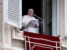 Pope Francis speaks during the Angelus prayer.